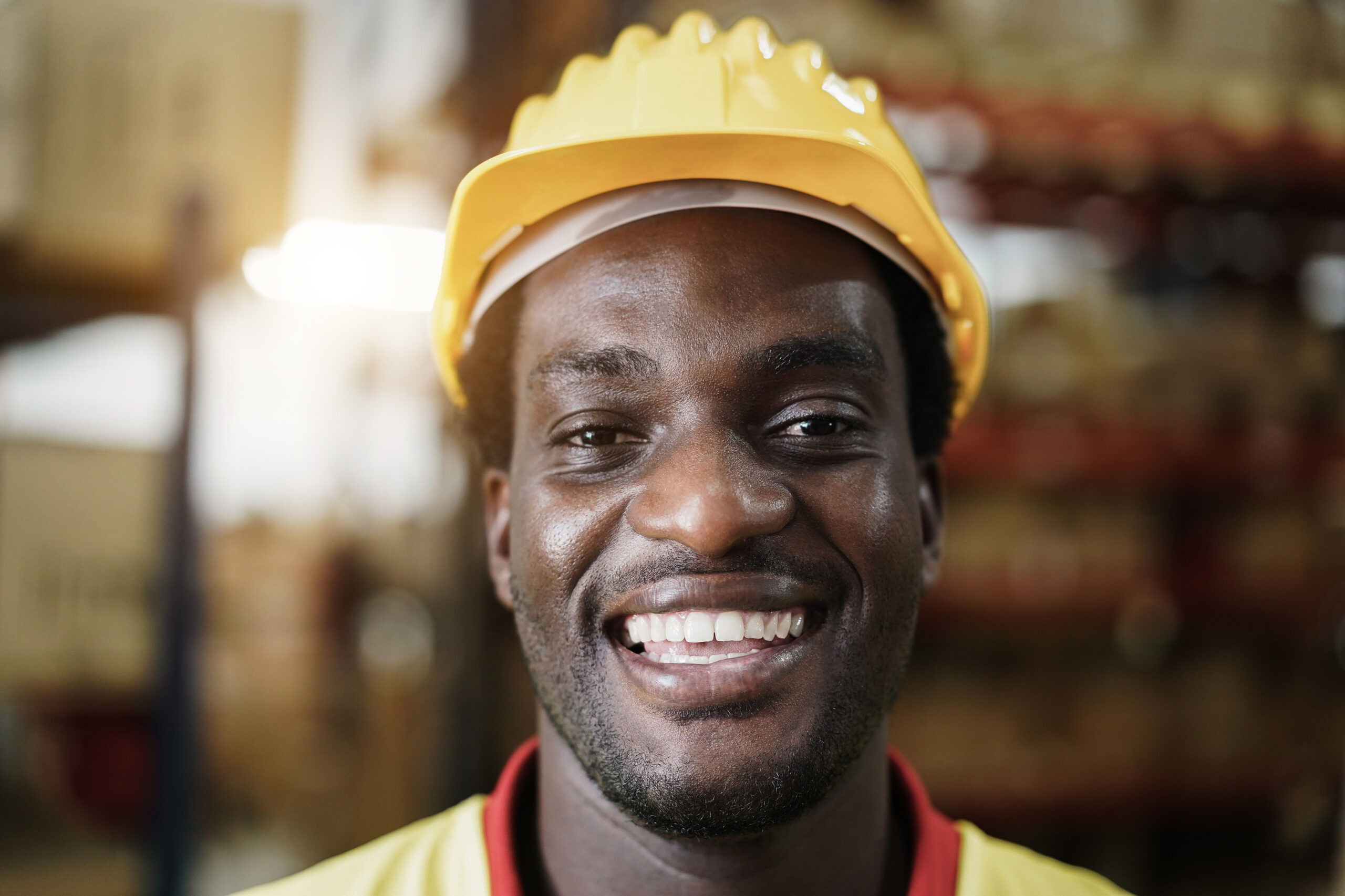 Happy manual labour worker in warehouse