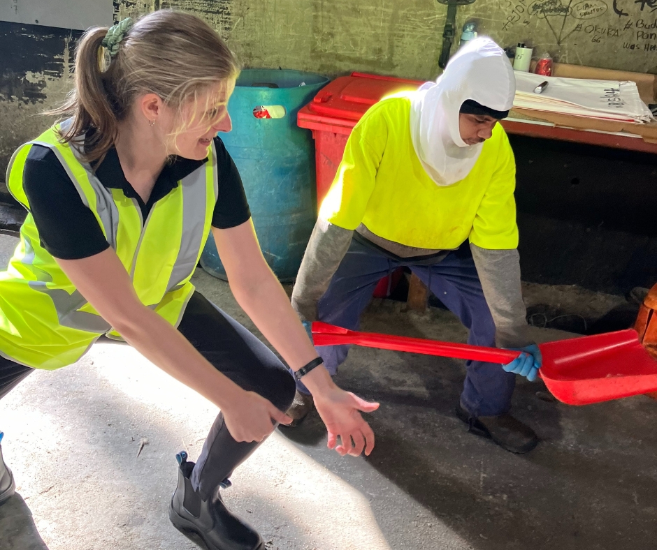 Workplace health provider demonstrates safe use of shovel to worker