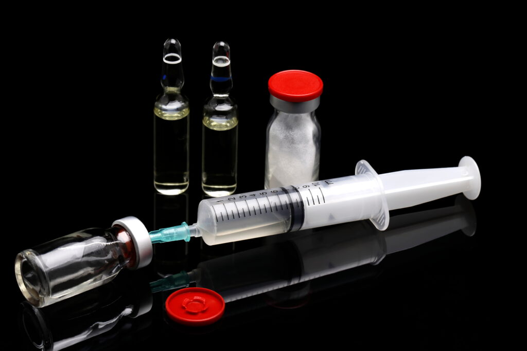 Image showing syringe and cortisone bottles